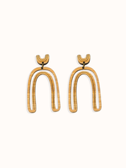 Arch shape delicate cut-out earrings on white background
