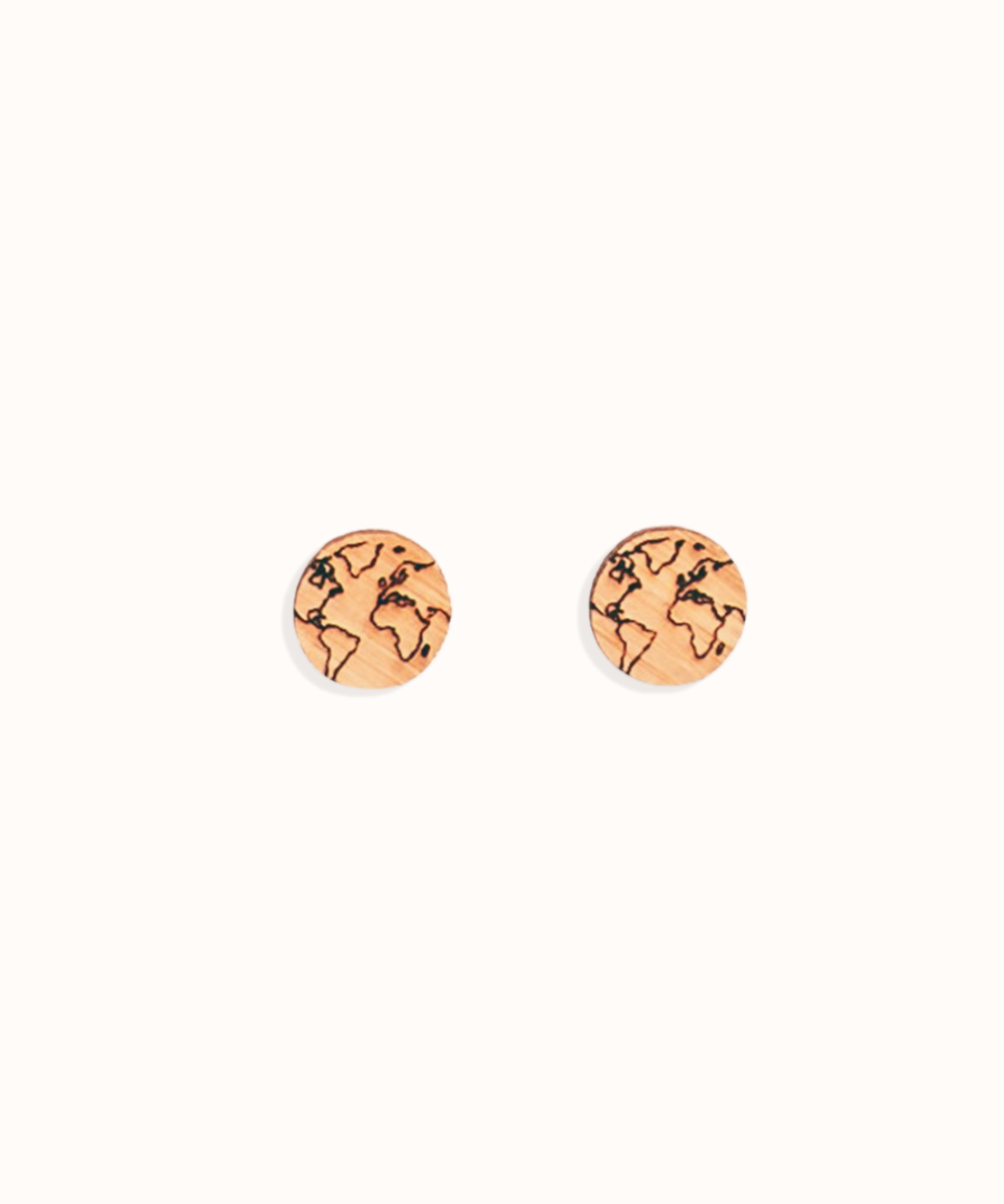 Pair of round earrings with world map design on a white background made out of bamboo