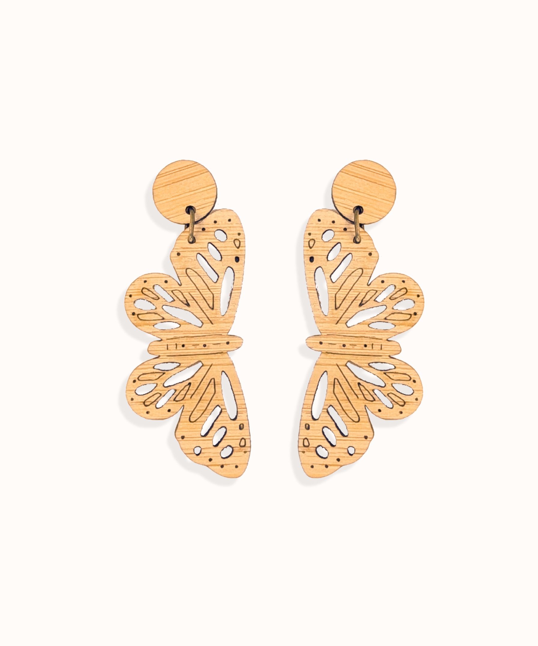 Butterfly-shaped bamboo dangles earrings on a white background