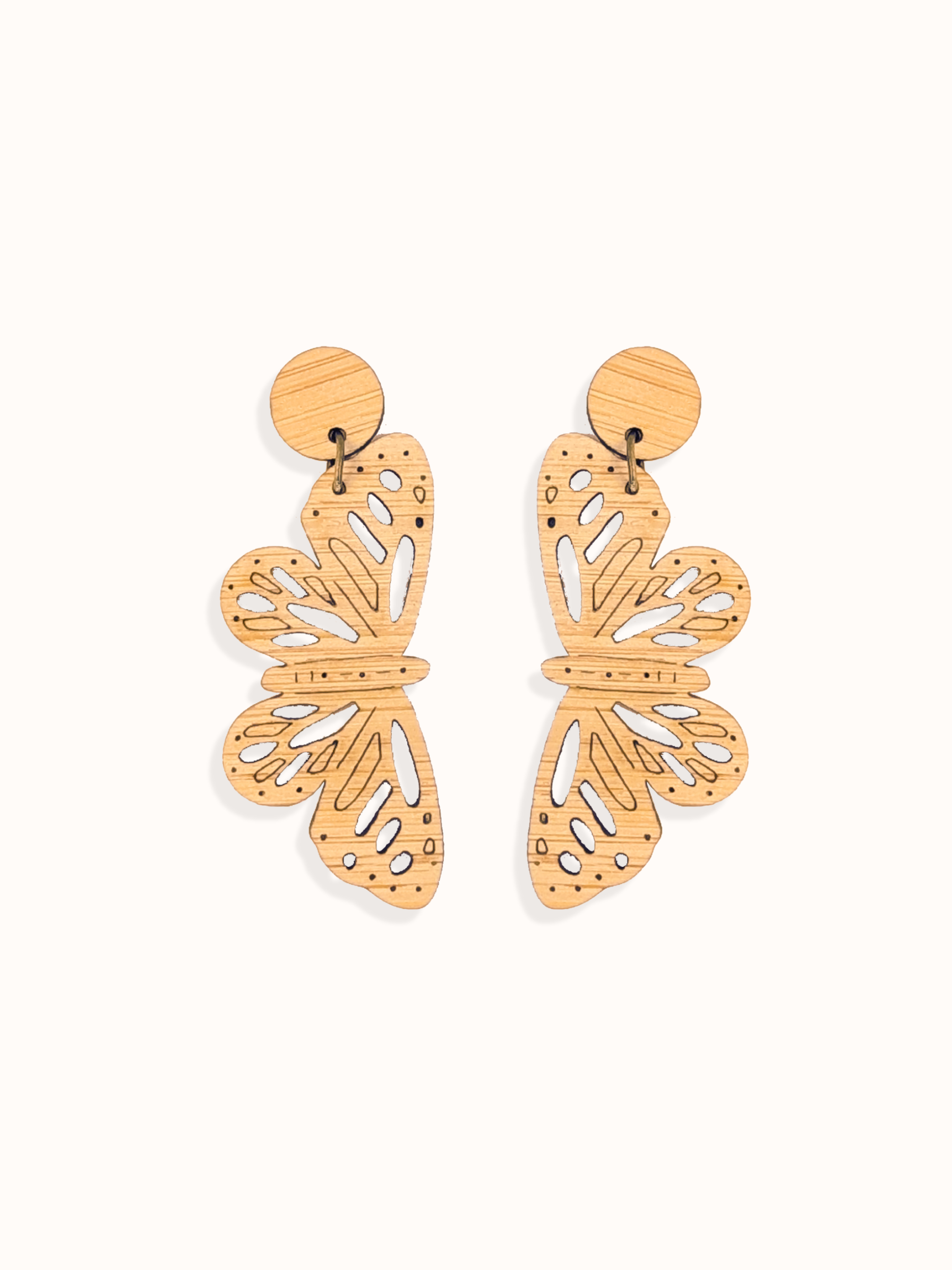 Butterfly-shaped bamboo dangles earrings on a white background