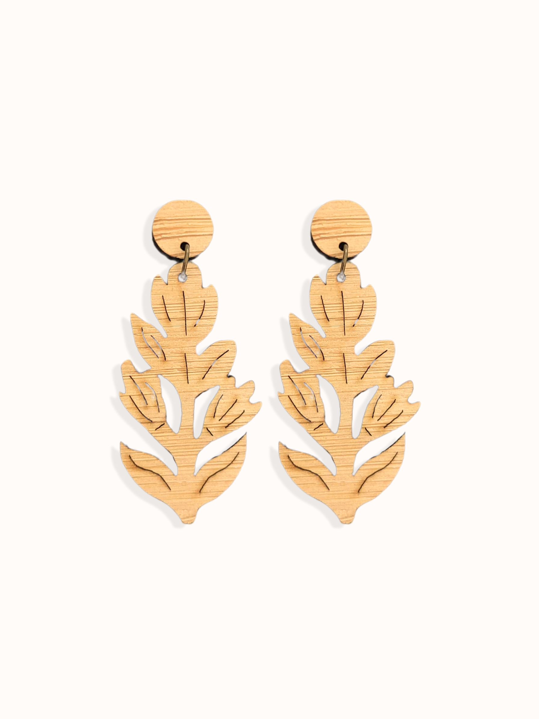Wooden paintbrush flower shaped handmade earrings on a white background