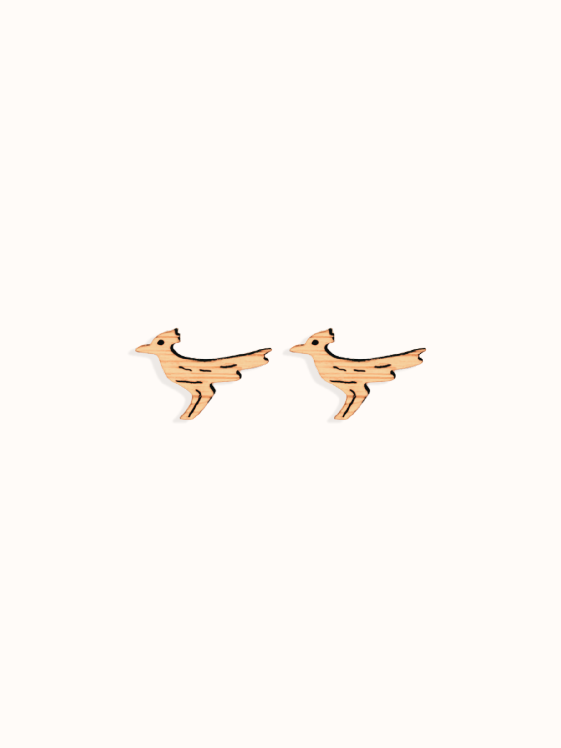 roadrunner stud earring on beige background