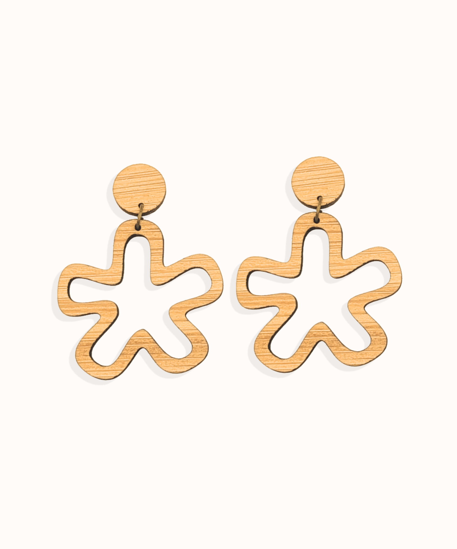Wooden minimalist daisy shaped earrings on a white background