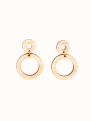 Pair of handmade bamboo wooden hoop earrings on a white background