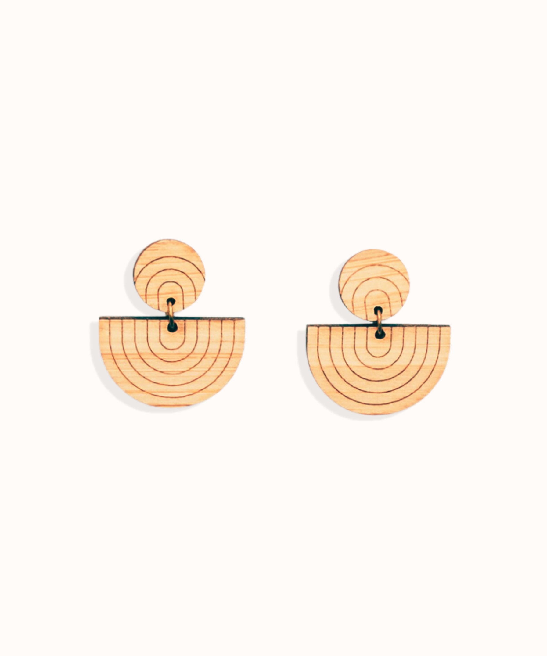 reverse rainbow laser cut drop bamboo earrings on a white background