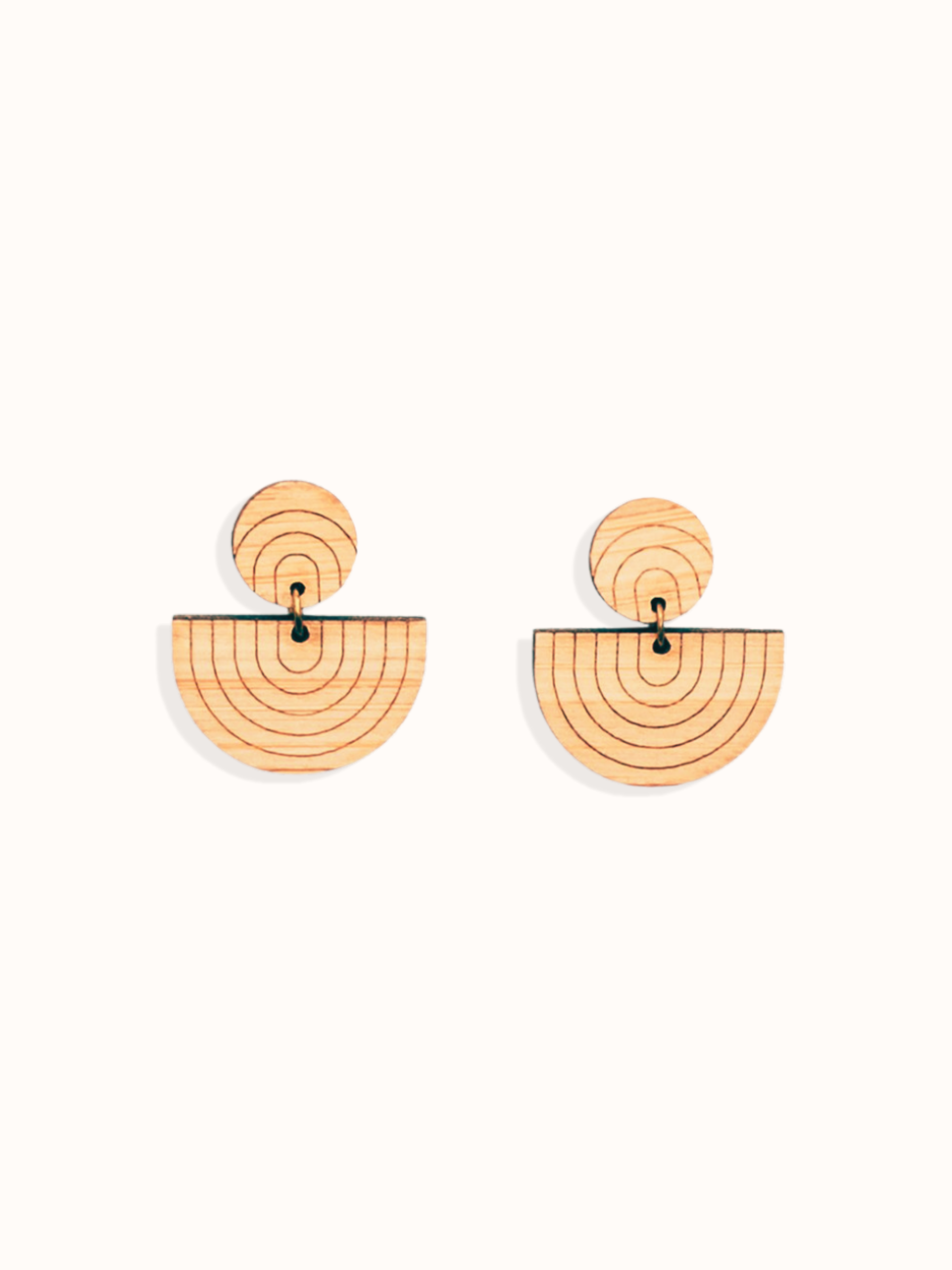 reverse rainbow laser cut drop bamboo earrings on a white background