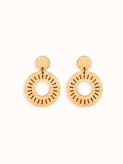 Pair of laser cut bamboo earrings with circular sun design on a white background. Perfect gift for your environmentally conscious friends.