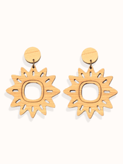 Pair of sun-shaped lightweight dangle earrings on a white background